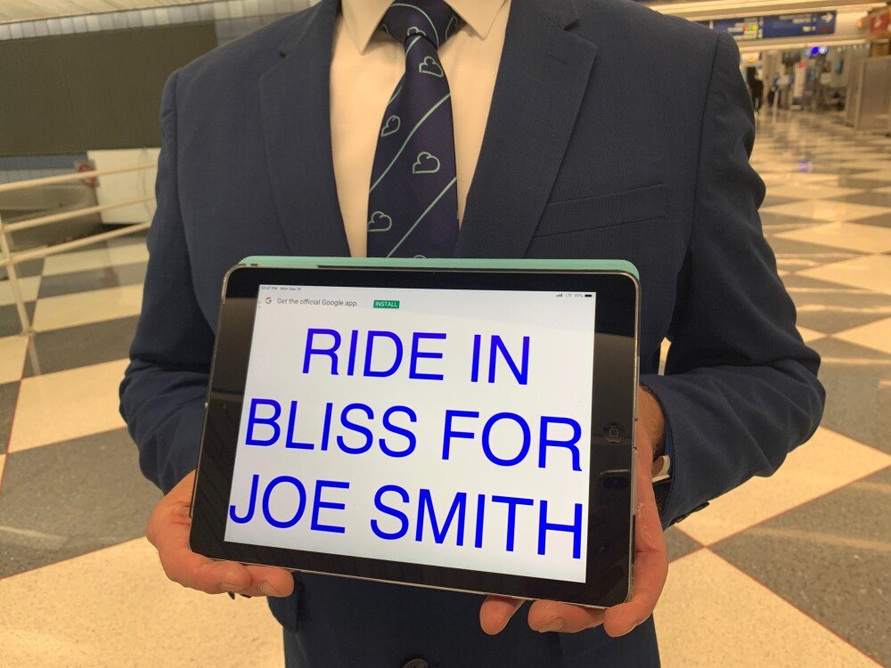 Driver holding a meet and greet sign at airport — Istanbul airport transfers