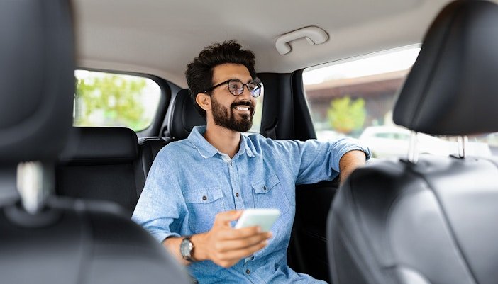 Smiling man in car — relaxed Istanbul airport transfer